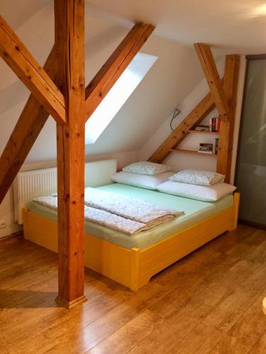 a bedroom with two beds in a attic at Apartment 23 in Český Krumlov