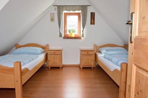 Postel nebo postele na pokoji v ubytování Penzion v Podhradí