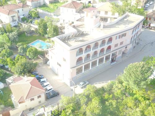 an overhead view of a white building with a parking lot at Byzantion Hotel in Mystras