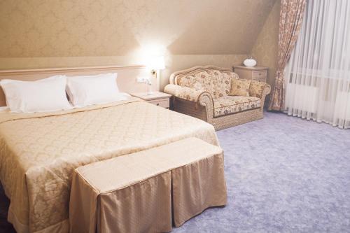 Postel nebo postele na pokoji v ubytování Aurora Premier Hotel