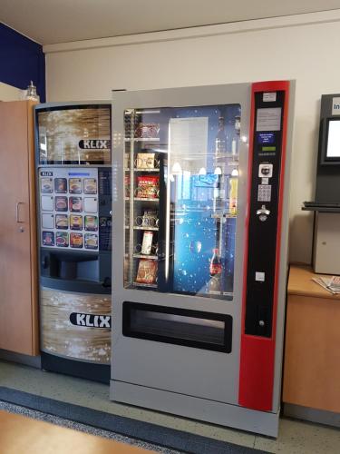 
a vending machine that has some drinks inside of it at ibis budget Erfurt Ost in Erfurt
