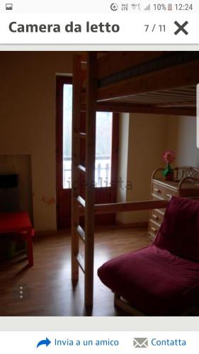 a living room with a bunk bed and a couch at respirodabruzzo in Villetta Barrea