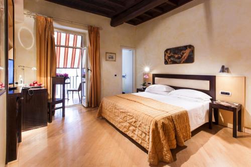 Postel nebo postele na pokoji v ubytování Hotel De Petris