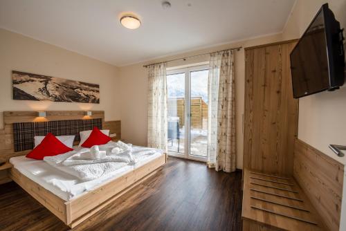 Postel nebo postele na pokoji v ubytování Bergerhof Alpin Lodge
