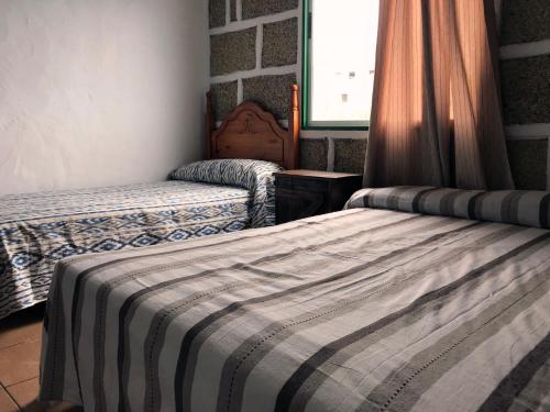เตียงในห้องที่ Casa Maria Luisa