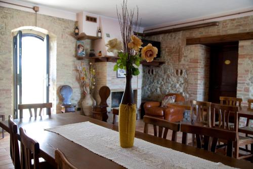 a vase of flowers on a table in a living room at Agriturismo San Fedele in Perugia