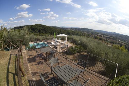 a view of a fence with chairs and a pool at Agriturismo San Fedele in Perugia