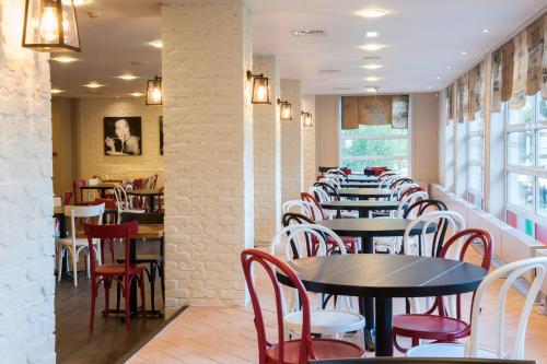 a row of tables and chairs in a restaurant at Macdonald Woodland Lodges at Macdonald Aviemore Resort in Aviemore