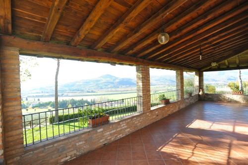 an outdoor patio with a view of the mountains at Agriturismo San Fedele in Perugia