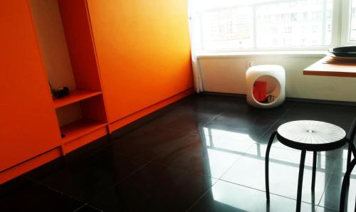 a bathroom with a urinal and a stool and a window at Walk distance to mokotow business park in Warsaw