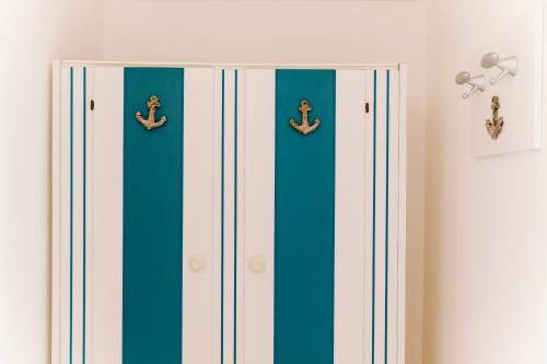 a closet with blue and white stripes at Hotel Villa Claudia in Bellaria-Igea Marina