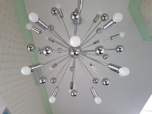 a chandelier hanging from a ceiling in a room at Grosvenor House Hotel in Torquay