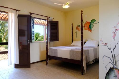 En eller flere senger på et rom på Hotel e Pousada La Dolce Vita