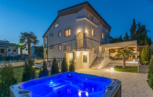 a large house with a hot tub in front of it at Villa Stephany in Poreč