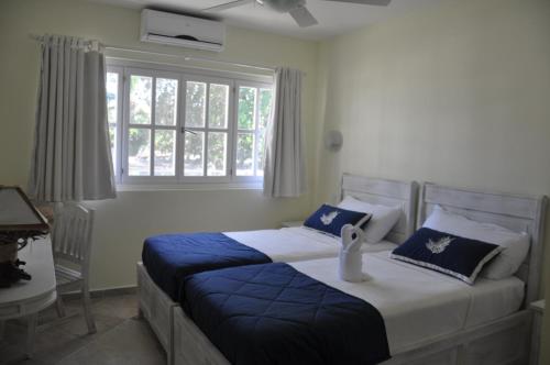 Postel nebo postele na pokoji v ubytování Hotel Residence Marilar