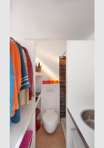 a bathroom with a toilet and a sink at Mini Loft ULB DELTA area with terrace in Brussels