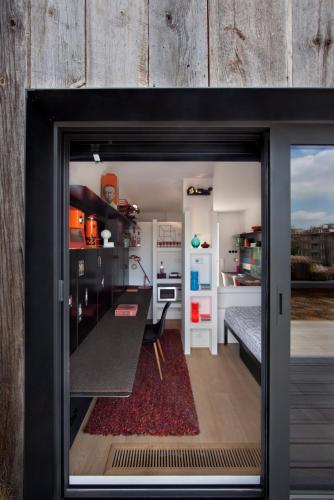 a view of a kitchen from inside a glass door at Mini Loft ULB DELTA area with terrace in Brussels