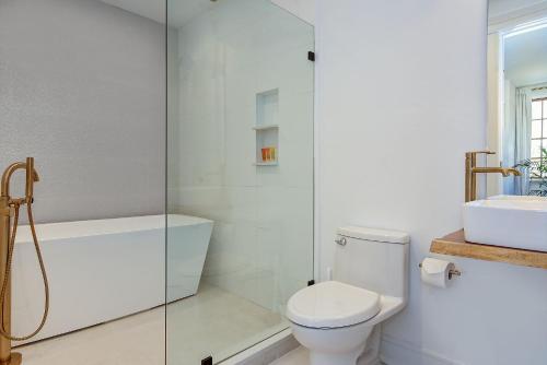 a bathroom with a toilet and a glass shower at Casablanca in Cape May