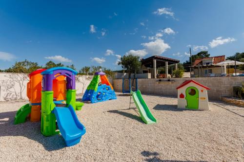 a group of childrens play equipment in a playground at Villa Mis in Supetar