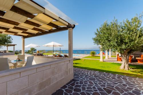 a view of the ocean from the patio of a villa at Villa Mis in Supetar