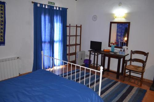 Ένα ή περισσότερα κρεβάτια σε δωμάτιο στο Hotel Restaurante Bandolero