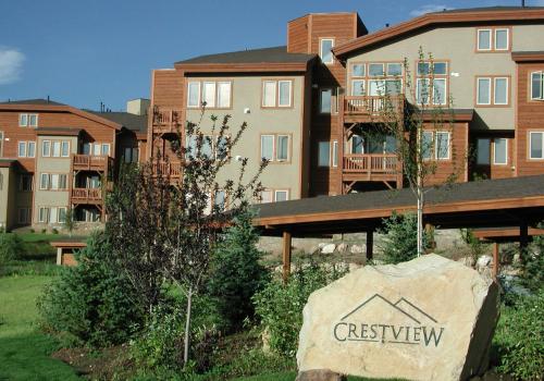 a building with a sign in front of it at Crestview Condominiums by All Seasons Resort Lodging in Park City