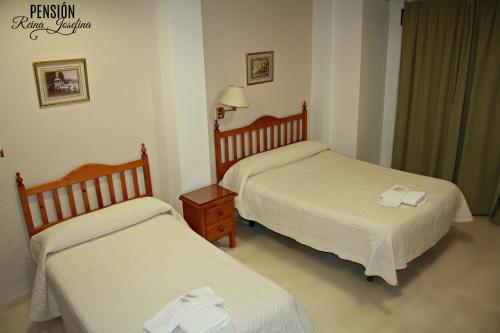 
Cama o camas de una habitación en Pension Reina Josefina
