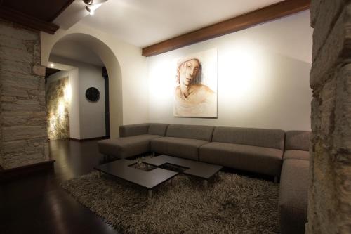 a living room with a couch and a table at 1850 Hotel Boutique in Guanajuato