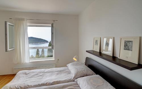 En eller flere senge i et værelse på Apartment 330