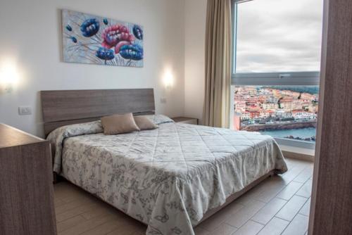 A bed or beds in a room at Castelsardo Miramare 10 - 6 posti