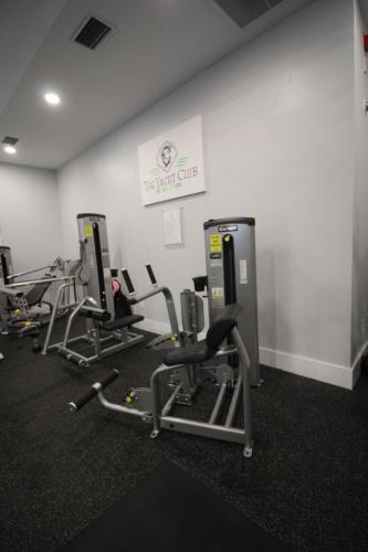 a gym with several rows of exercise equipment in a room at Yacht Club at Aventura 1 Bd 1 Bth Brand New in Aventura