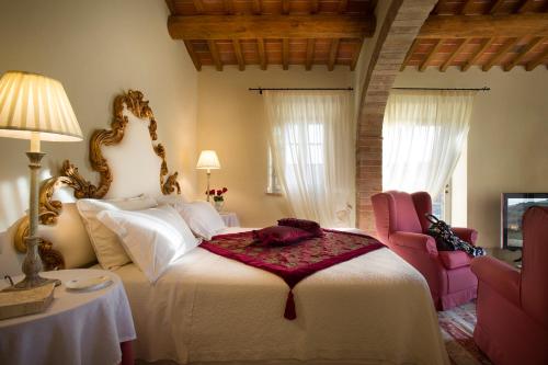 A bed or beds in a room at Villa San Sanino - Relais in Tuscany