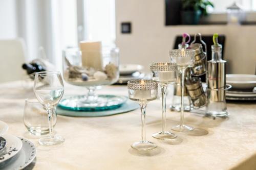 a group of wine glasses sitting on a table at Angolo Paradiso - Lago di Como in Valbrona