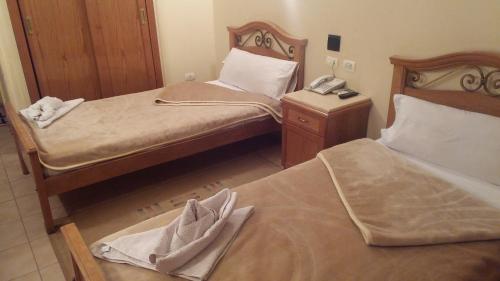 Cama o camas de una habitación en Applicators Hotel