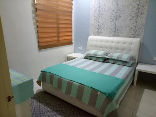 Katil atau katil-katil dalam bilik di Miker Homestay