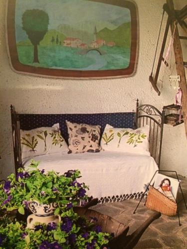 Una cama o camas en una habitación de A Casa di Gianni e Mari