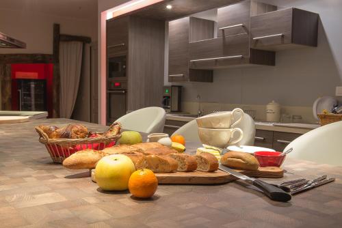 a table with a plate of food on a table in a kitchen at Domaine Jobert in Aubagne