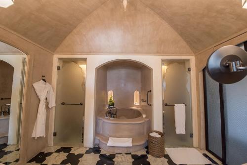 a large bathroom with a tub and a sink at Fairmont Jaipur in Jaipur