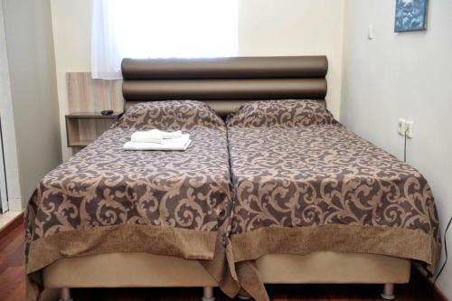 Postel nebo postele na pokoji v ubytování Hotel Vergina