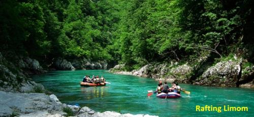 a group of people in boats on a river at B&B Hisar International in Prijepolje