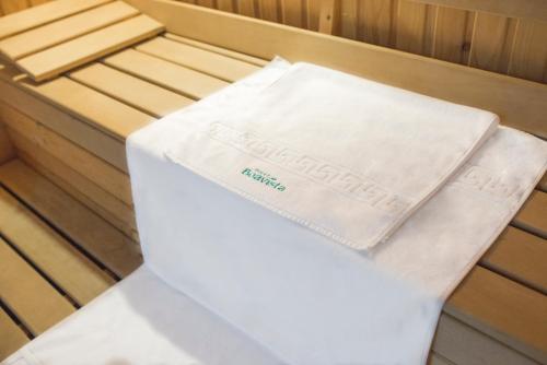 a white towel sitting on the inside of a boat at Hotel Boavista in Timişoara