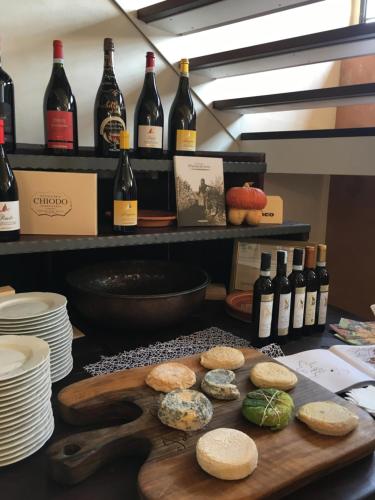 a table with a bunch of bottles of wine at Albergo Rondò in Acqui Terme
