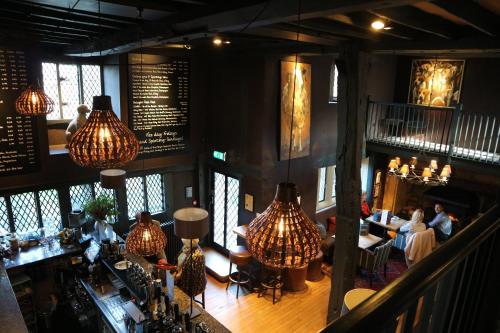 an overhead view of a restaurant with people sitting at tables at The Broadway Hotel in Broadway