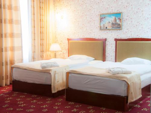 Ένα ή περισσότερα κρεβάτια σε δωμάτιο στο Golden Valley Hotel