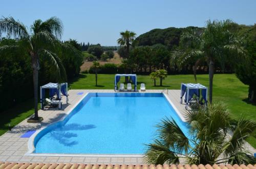 a large swimming pool with two water slides at Agriturismo Serafina in Otranto