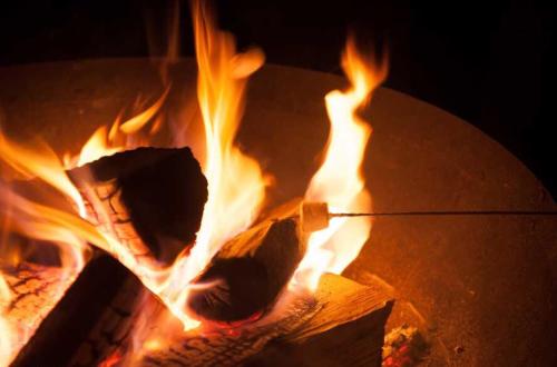 a pizza is cooking in a fire oven at Mid Wales Luxury Huts in Darowen