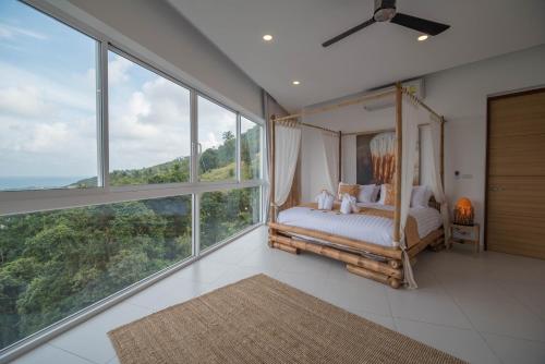 Postel nebo postele na pokoji v ubytování Villa Melissa Samui Sea View