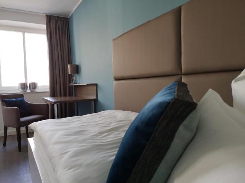 Trip Inn PostApart Aschaffenburgにあるベッド