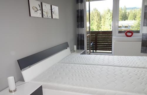Postel nebo postele na pokoji v ubytování Apartman "21"