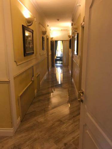 a hallway of a home with wooden floors at Hotel Vandelli in Pavullo nel Frignano